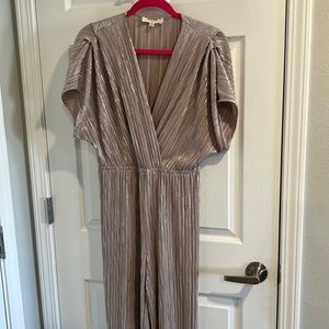 Muted silver jumpsuit, worn once! Perfect for a special event or night out.